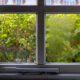 Double glazed window showing condensation droplets between two panes of glass