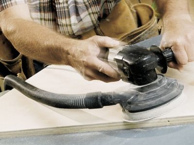 man using sanding machine