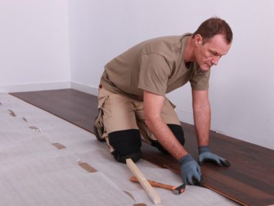 Man installs a laminate floor