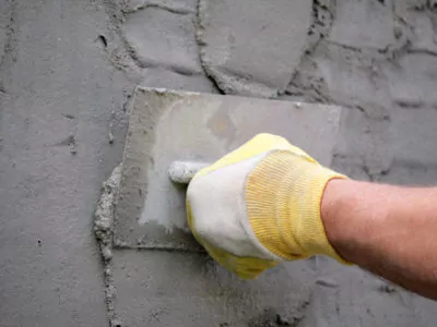 Applying stucco to exterior wall