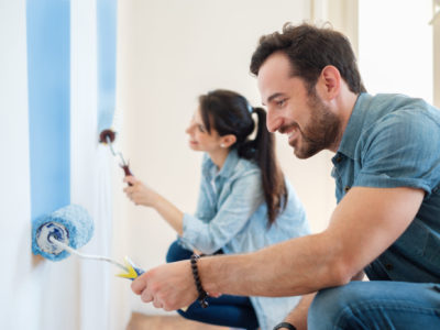 Renovation diy paint couple in new home painting wall together