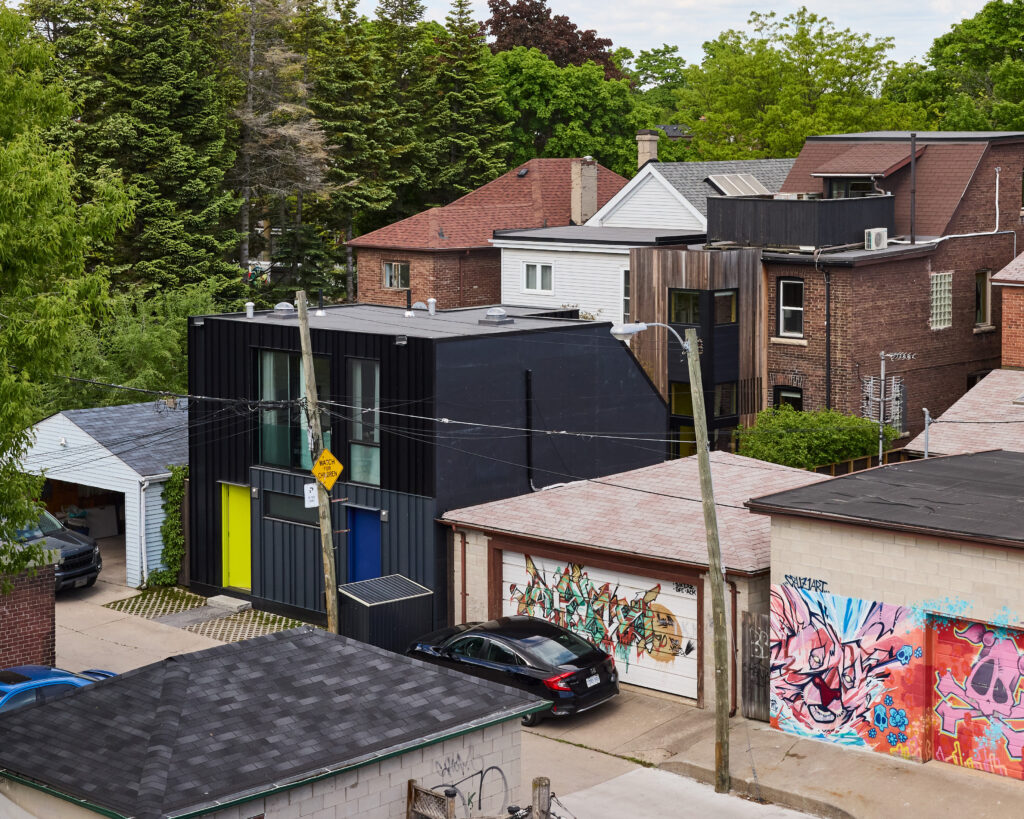 In Toronto, a couple replaced the garage behind their townhouse with an ADU that contains a home studio with a rental apartment above it.