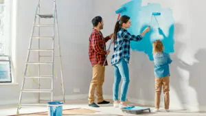 Family doing a painting project together