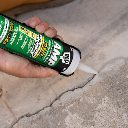 Caulking cracks in a concrete floor